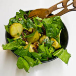 alt="potato and spinach salad with sun-dried tomatoes and chopped roasted almonds."