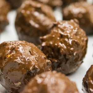 alt="close-up of the chocolate covered spiced almond bites."