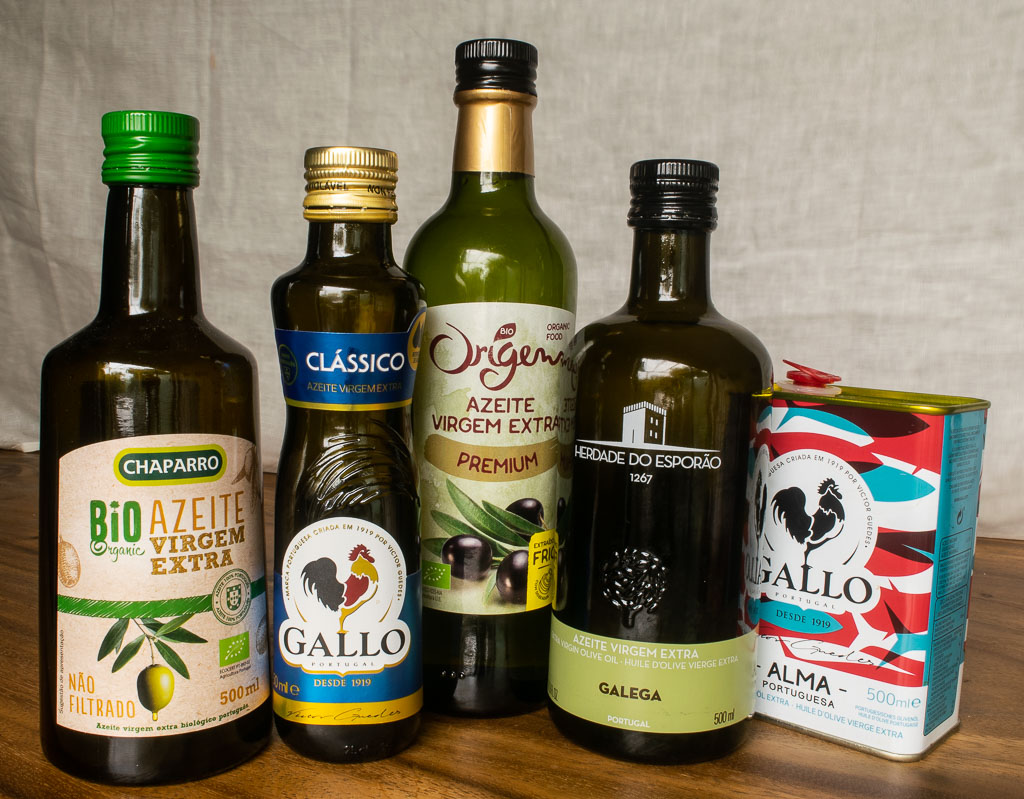 alt="different bottles of extra virgin olive oil."