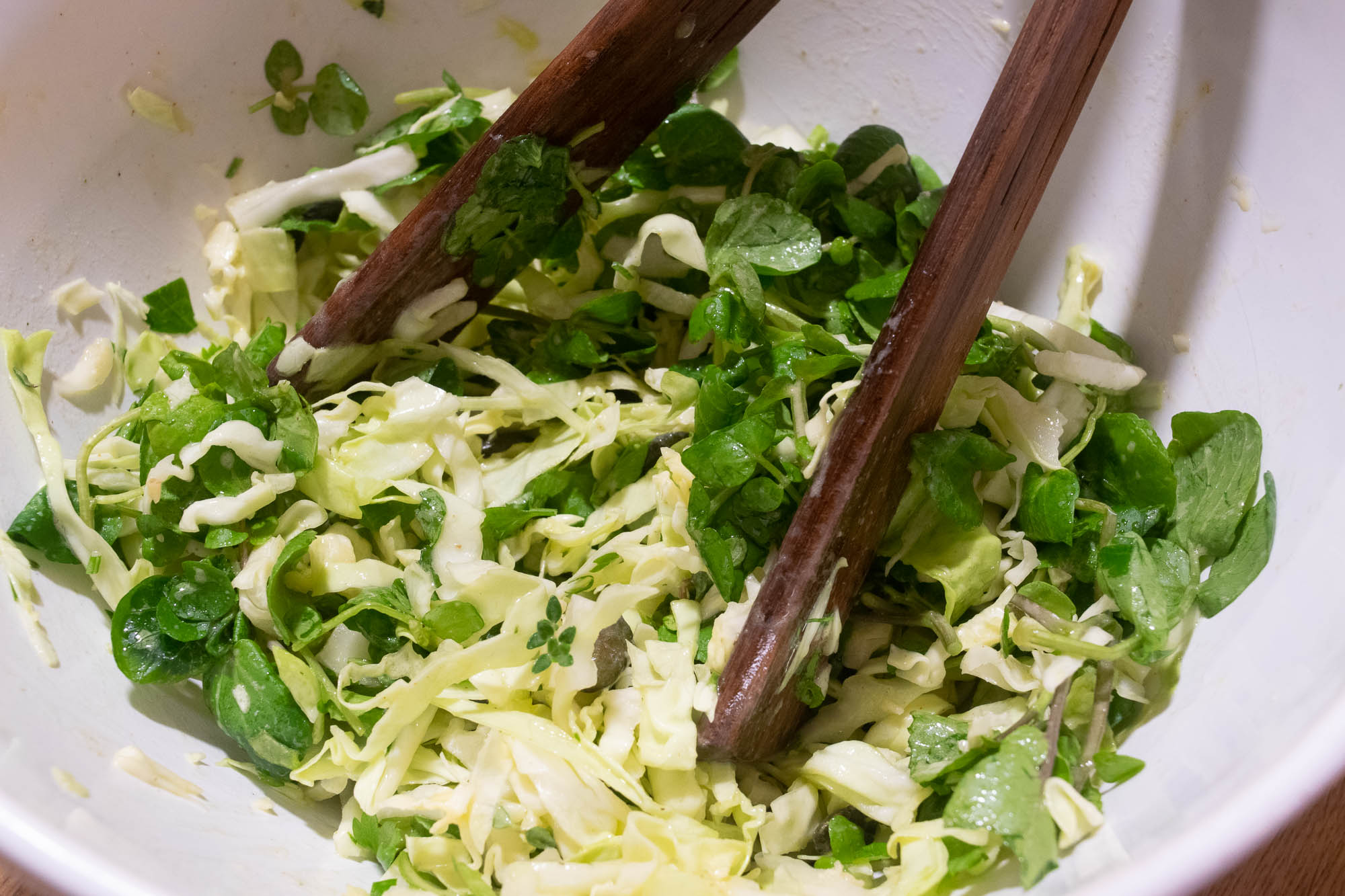 alt="cabbage and watercress salad."
