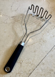 alt="a kitchen tool used when making mashed potatoes."